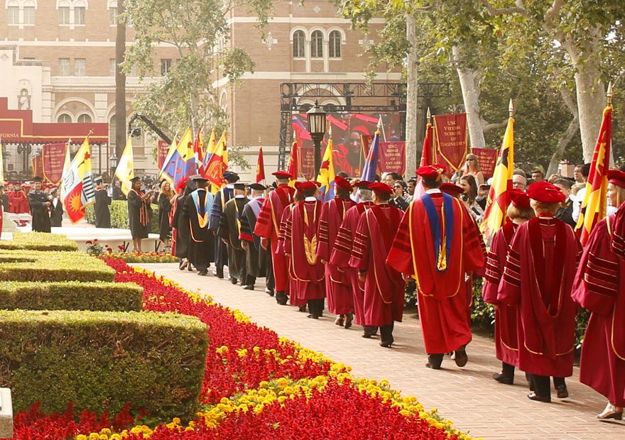 students and faculty in regalia